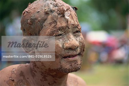 Portrait of a Worship man with a muddy face during Loei Peetakhon festival in Thailand, Southeast Asia, Asia
