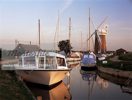 Boats moored near Horsey windmill, Norfolk Broads, Norfolk, England, United Kingdom, Europe