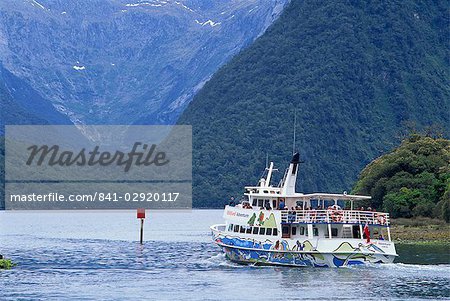 Tourists on a Fiord Boat Tour on the Milford Sound in the South Island of New Zealand, Pacific