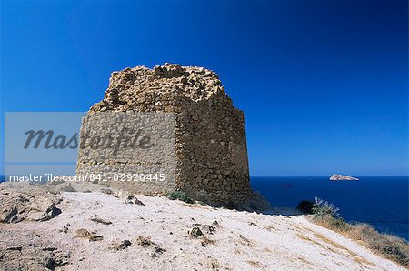 Clifftop ruin at the Punta de l'Escaleta, Benidorm island in distance, Benidorm, Alicante, Valencia, Spain, Europe
