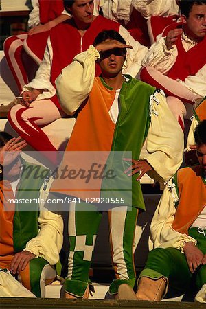 Colourfully dressed contrada member watching the Palio, Siena, Tuscany, Italy, Europe