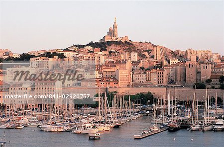View across the Vieux Port to Basilica of Notre Dame de la Garde, Marseille, Bouches-de-Rhone, Provence-Alpes-Cote-d'Azur, France, Europe