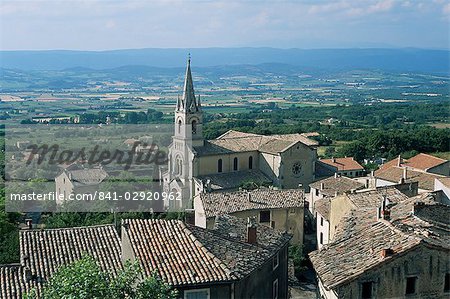 View over village and church to Luberon countryside, Bonnieux, Vaucluse, Provence, France, Europe