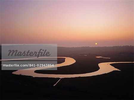 Sunset over the River Cuckmere at Cuckmere Haven, East Sussex, England, United Kingdom, Europe