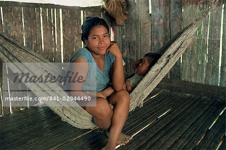 A Guyami Indian woman and child in a hammock at Bisira, Panama, Central America