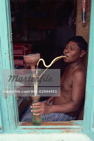 Shopkeeper with hookah, Male, Maldive Islands, Indian Ocean, Asia