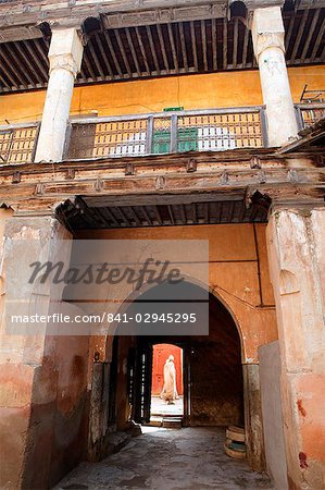 View out from courtyard with figure walking by, Marrakech, Morrocco, North Africa, Africa