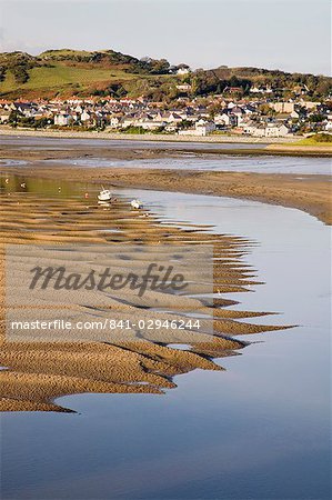 Exposed rippled sandbank on Conwy River estuary at low tide, with Deganwy beyond, Conwy, Wales, United Kingdom, Europe