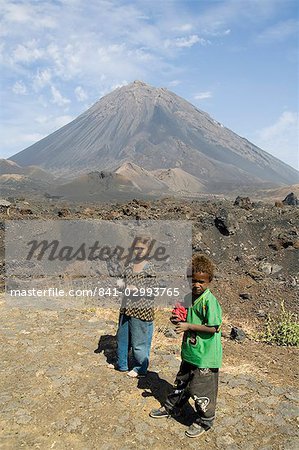 Child vendors selling souvenirs, with the Pico de Fogo volcano in the background, Fogo (Fire), Cape Verde Islands, Africa