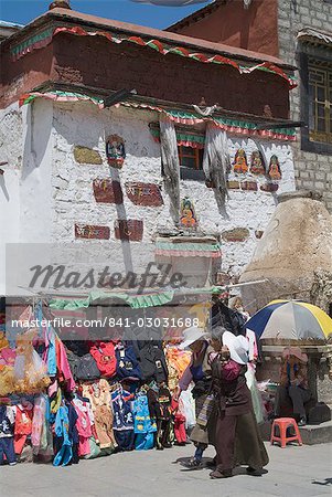 Market stall in front of traditional Tibetan architecture, Barkhor, Lhasa, Tibet, China, Asia