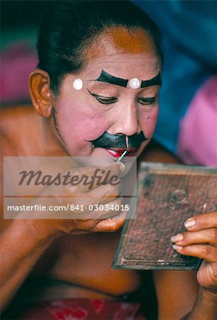 Applying make-up for the Barong classical dance, temple of Batubulan, island of Bali, Indonesia, Southeast Asia, Asia