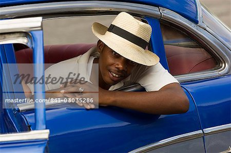 Man in a blue car,Havana,Cuba,West Indies,Central America