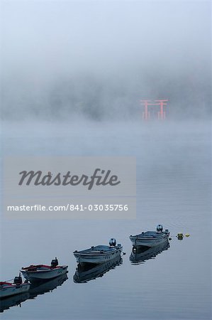 Small boats in the mist on lake Ashi (Ashiko),Hakone,Kanagawa prefecture,Japan,Asia