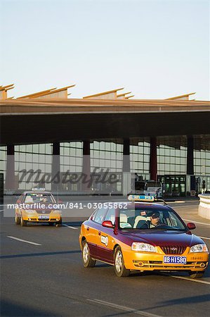 Taxis leaving Beijing Capital Airport part of new Terminal 3 building opened February 2008, second largest building in the world, Beijing, China, Asia