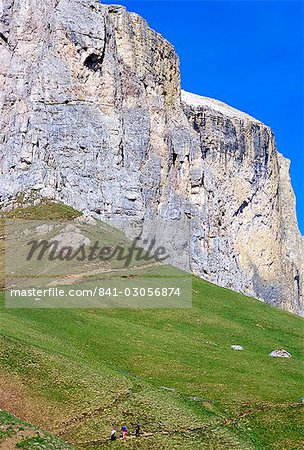 Walkers on trail above Sella Pass, 2244m, Dolomites, Alto Adige, Italy, Europe Walkers on trail above Sella Pass, 2244m, Dolomites, Alto Adige, Italy, Europe