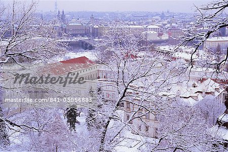 Snow covered Mala Strana and Stare Mesto rooftops, Prague, Czech Republic, Europe Snow covered Mala Strana and Stare Mesto rooftops, Prague, Czech Republic, Europe