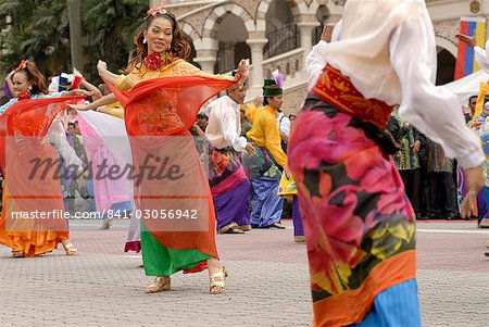 Malay female dancers wearing traditional dress at celebrations of Kuala Lumpur City Day Commemoration, Merdeka Square, Kuala Lumpur, Malaysia, Southeast Asia, Asia