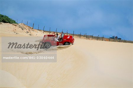 Dune buggy on sand dunes, Pitangui, Natal, Rio Grande do Norte state, Brazil, South America