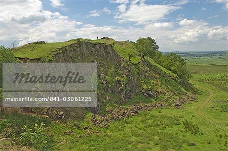 Walltown Crags, walker on the skyline at Turret 45b, Hadrians Wall, Northumbria, England, United Kingdom, Europe