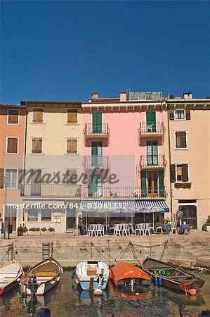 Boats moored in the little harbour and waterfront cafe at Pai, Lake Garda, Veneto, Italy, Europe