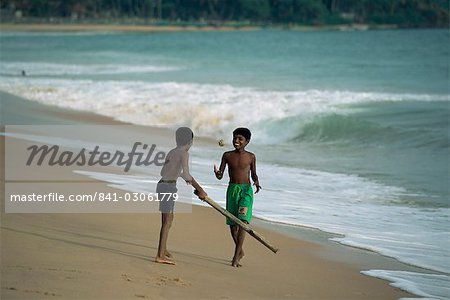 Boys playing cricket, Hikkaduwa beach, Sri Lanka, Asia