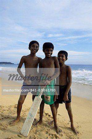 Boys playing cricket, Hikkaduwa beach, Sri Lanka, Asia