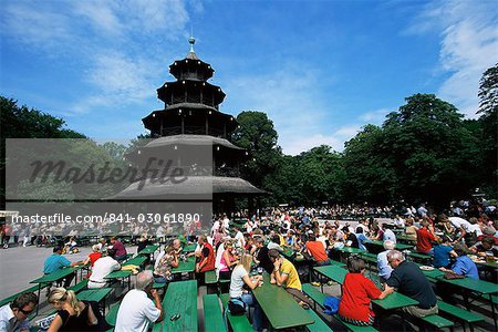 People sitting at the Chinese Tower beer garden in the Englischer Garten, Munich, Bavaria, Germany, Europe