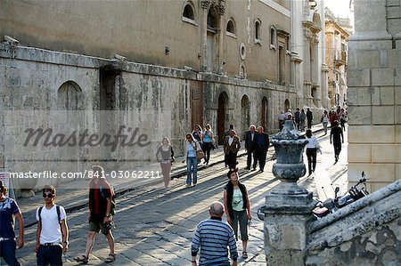 People walking by the main street in Noto, Sicily, Italy, Europe