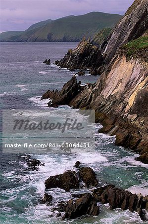 Rocky coast of Slea Head, and Blasket islands in the distance, Dingle peninsula, County Kerry, Munster, Republic of Ireland, Europe