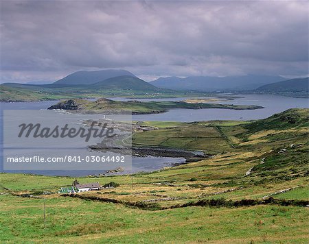 Lighthouse, Beginish Island, Doulus Bay and Knocknadobar in the distance, viewed from Valentia island, Ring of Kerry, County Kerry, Munster, Republic of Ireland, Europe