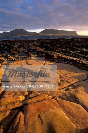 Red sandstone shore, Hoy Island and Hoy Sound from Mainland, Orkney Islands, Scotland, United Kingdom, Europe