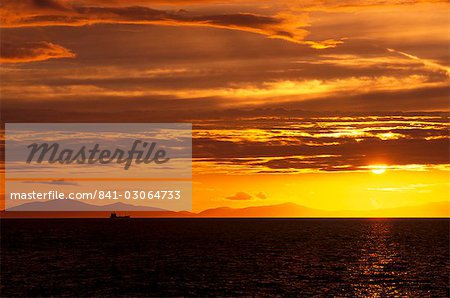 Tanker in the Little Minch, between Skye and Harris, at sunset, Isle of Skye, Inner Hebrides, Scotland, United Kingdom, Europe