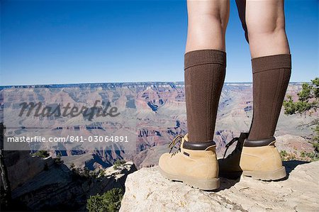 Woman looking over Grand Canyon, Grand Canyon National Park, UNESCO World Heritage Site, Arizona, United States of America, North America