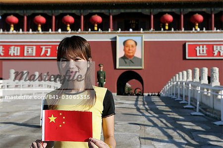 Chinese woman with flag, the Heavenly Gate to the Forbidden City, Tiananmen Square, Beijing, China, Asia