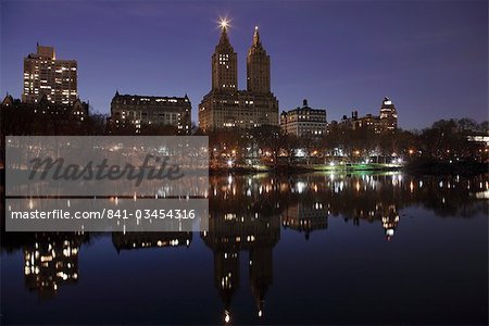 The San Remo Towers, Central Park West skyline at night reflected in the Lake, Central Park, Manhattan, New York City, United States of America, North America