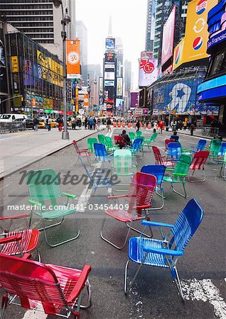 Garden chairs in the road for the public to sit and relax in the pedestrian zone, Times Square, New York City, New York, United States of America, North America