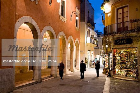 Locals in street at night, Taormina, Sicily, Italy, Europe