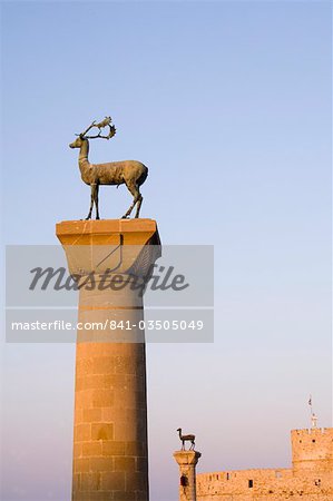 Stag and doe statues atop pillars at the entrance to Mandraki Harbour, Rhodes, Dodecanese Islands, Greek Islands, Greece, Europe