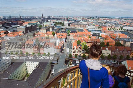 Tourists looking at view from the 17th century Vor Frelsers Church, Copenhagen, Denmark, Scandinavia, Europe