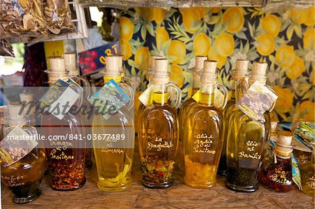 Olive oil for sale on market stall near Positano, Amalfi Coast road, Campania, Italy, Europe