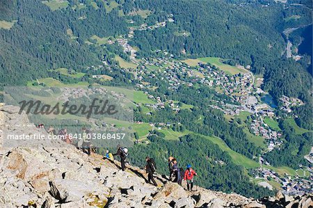 Hikers above Chamonix Valley, Mont Blanc Massif, French Alps, France, Europe