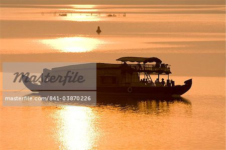 Houseboat at dusk in Ashtamudi Lake, Kollam, Kerala, India, Asia