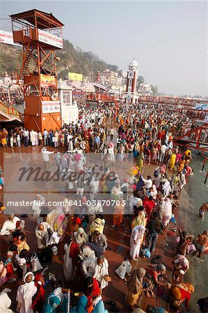 Thousands of devotees converge to take a dip in the River Ganges at Navsamvatsar, a Hindu holiday during the Maha Kumbh Mela festival, Haridwar, Uttarakhand, India, Asia