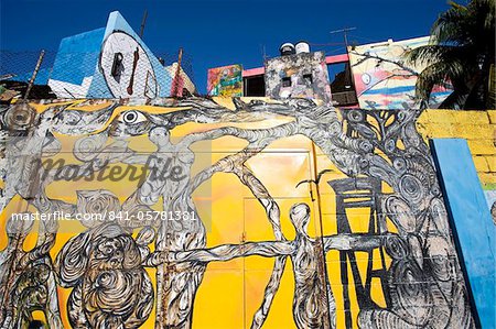 Buildings painted in colourful Afro-Cuban art, masterminded by artist Salvador Gonzalez Escalona, Callejon de Hamel, Havana, Cuba, West Indies, Central America