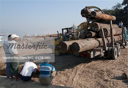 Timber depot, Yadanabon bridge, Sagaing, Irrawady River. Myanmar, Asia