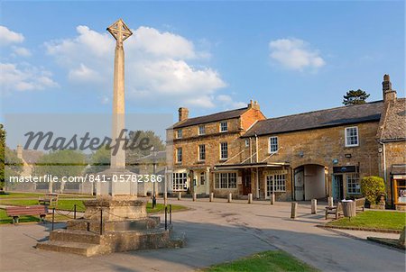 War Memorial stone cross on the High Street in the village of Broadway, The Cotswolds, Worcestershire, England, United Kingdom, Europe