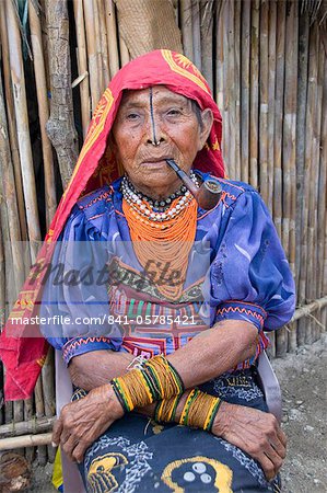 Kuna woman smoking a pipe, Playon Chico Village, San Blas Islands (Kuna Yala Islands), Panama, Central America