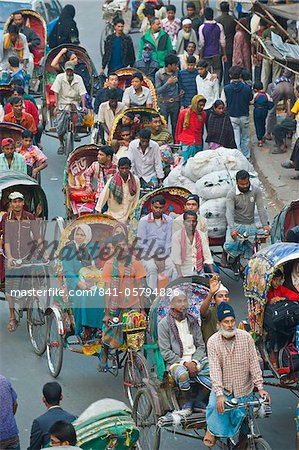 Busy rickshaw traffic on a street crossing in Dhaka, Bangladesh, Asia