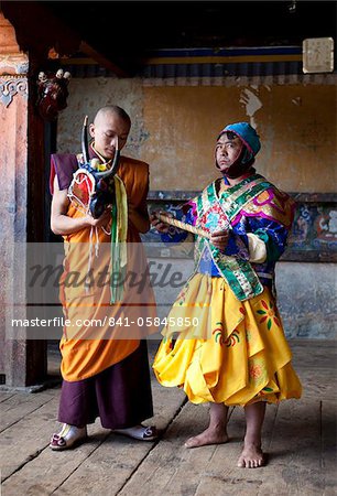 Buddhist monk in colourful costume waiting to take part in traditional dance at the Tamshing Phala Choepa Tsechu, near Jakar, Bumthang, Bhutan, Asia