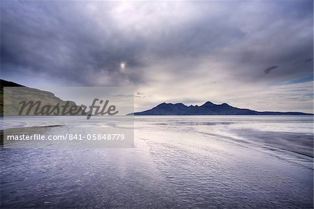 Early evening view towards Rum from the Bay of Laig on the Isle of Eigg, Hebrides, Scotland, United Kingdom, Europe